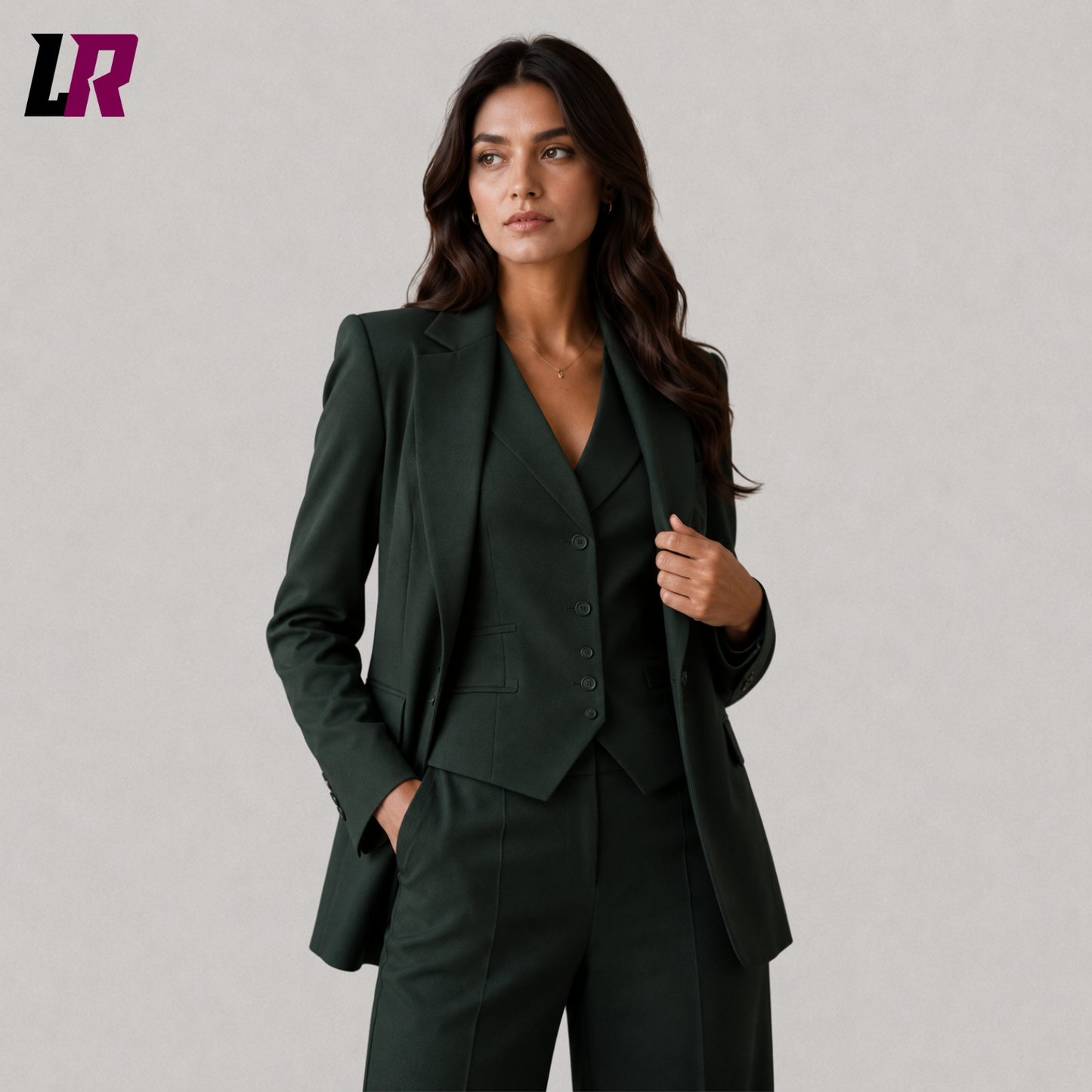 Close-up of forest green women's business suit featuring premium handmade tailoring and matching vest