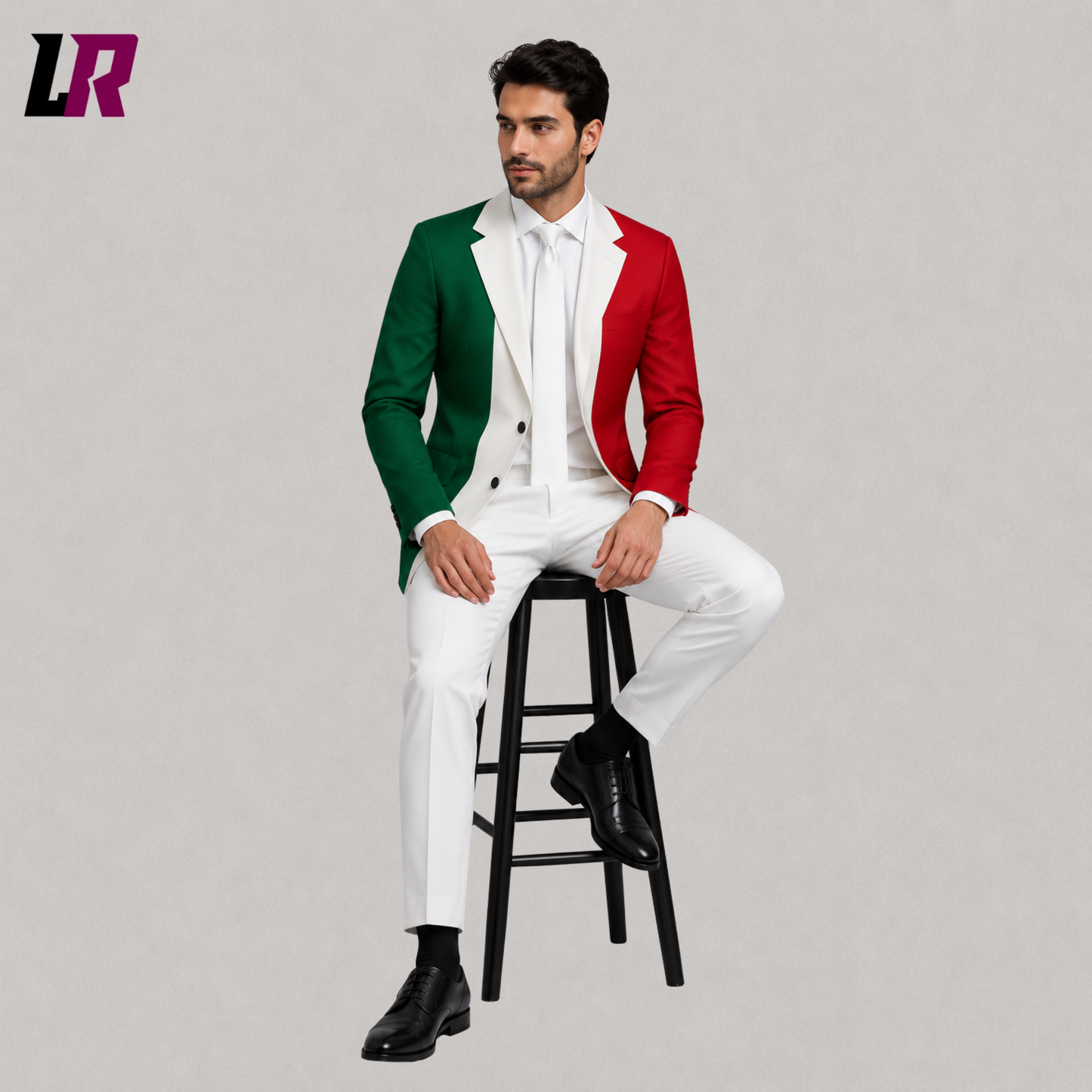 Man wearing a custom tailored Italian Flag Suit while sitting on a stool in a modern studio portrait