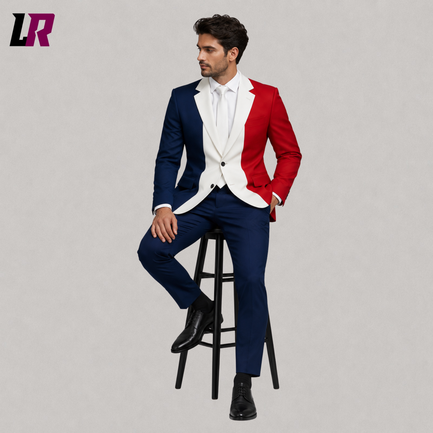 Man wearing a France Flag Suit while sitting on a stool in a modern studio portrait