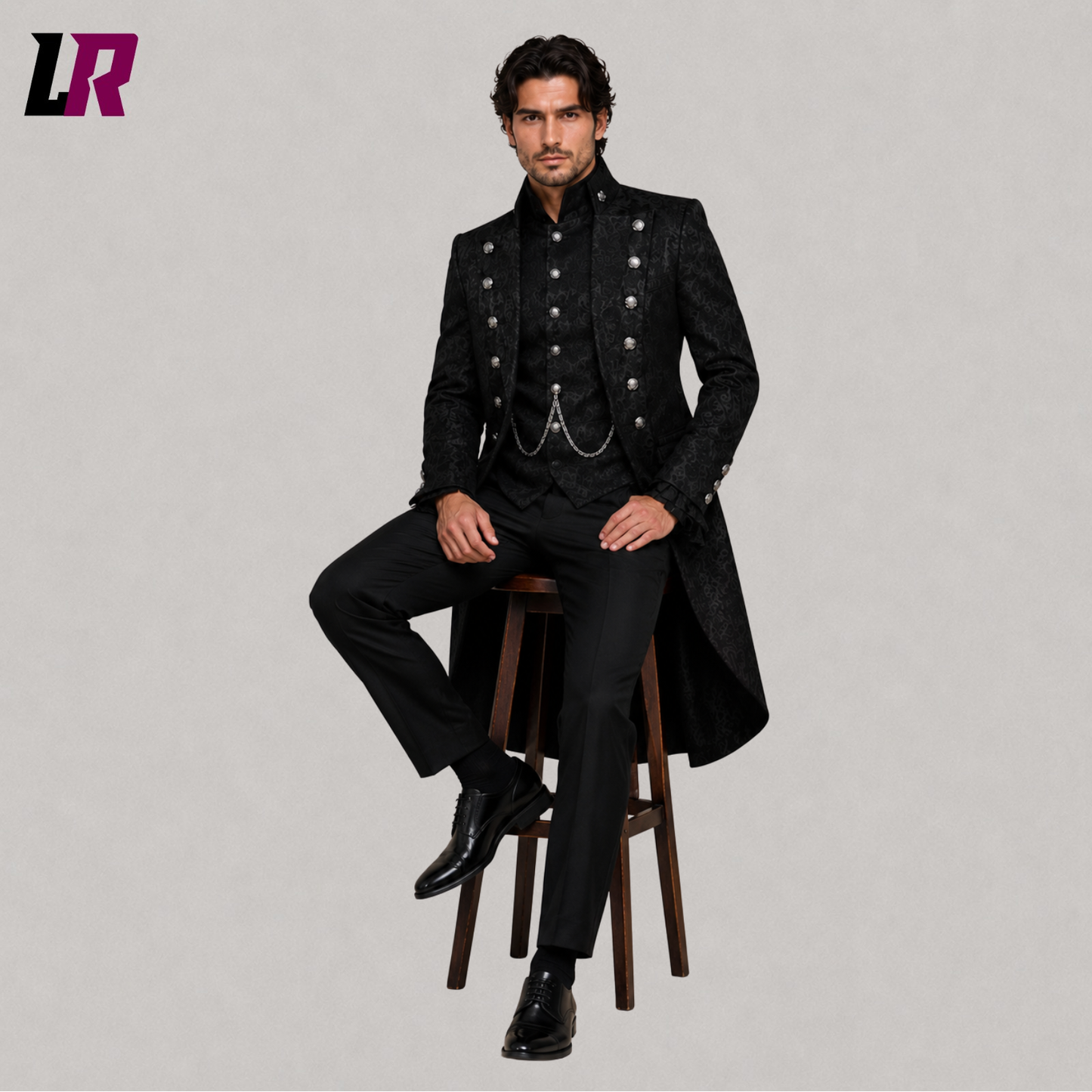 Men's black Gothic Victorian prince tailcoat with model seated on a stool in a luxury formal fashion pose
