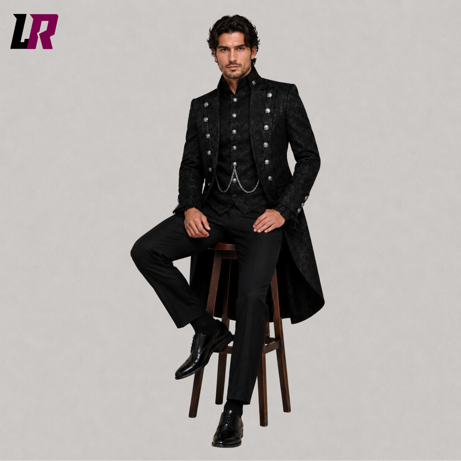 Men's black Gothic Victorian prince tailcoat with model seated on a stool in a luxury formal fashion pose