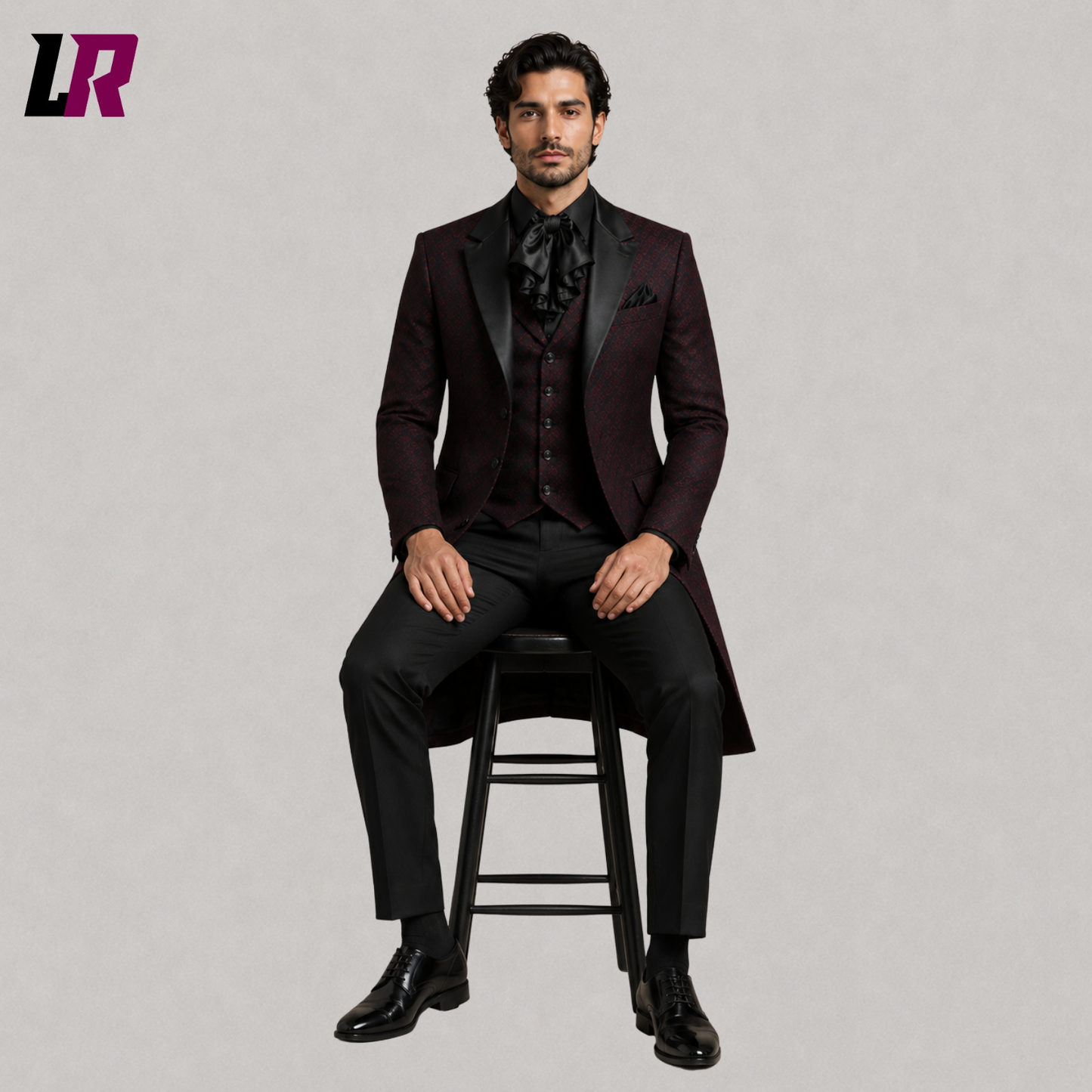 Man sitting on a stool wearing a Burgundy Gothic Tailcoat Suit for Men with Victorian long coat and black formal pants