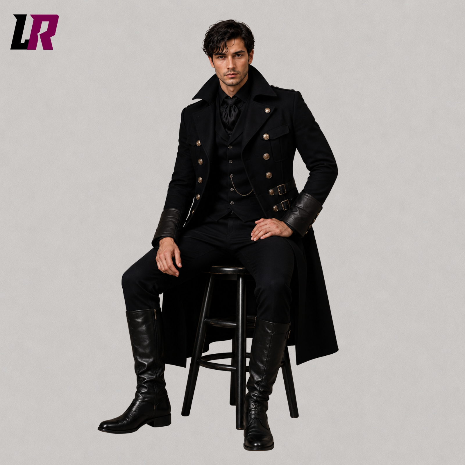 Man sitting on a stool wearing a black Victorian Gothic long coat for formal events and weddings