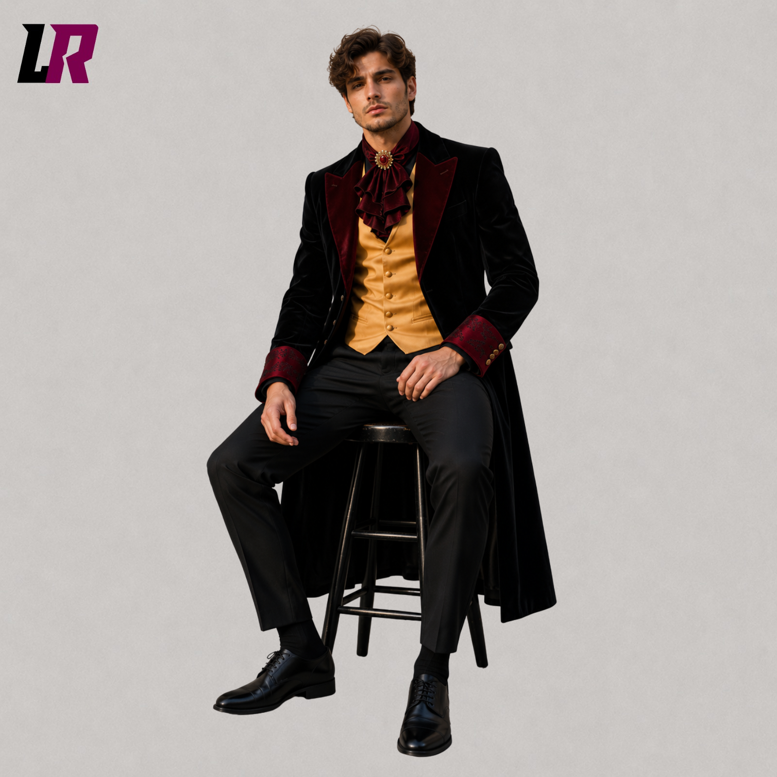 Man sitting on a stool wearing a black velvet Victorian tailcoat for weddings and formal occasions