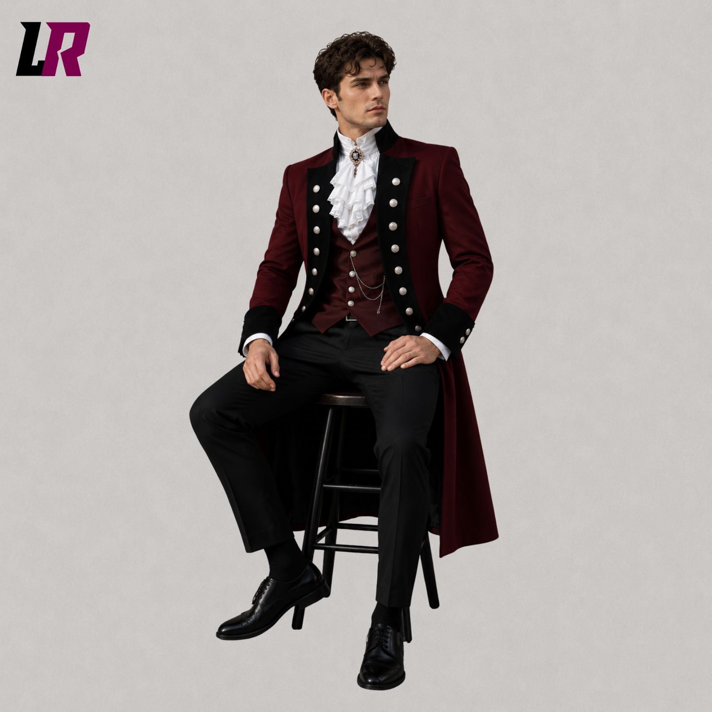 Man sitting on a stool wearing a burgundy Victorian Gothic 3-piece tailcoat suit for weddings and formal occasions