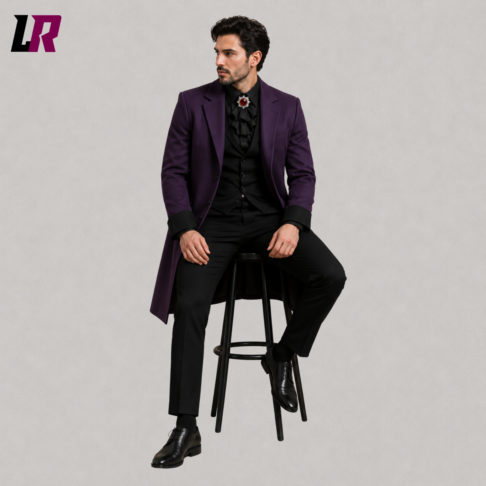 Man sitting on a stool wearing a purple Victorian Gothic tailcoat for weddings and formal occasions