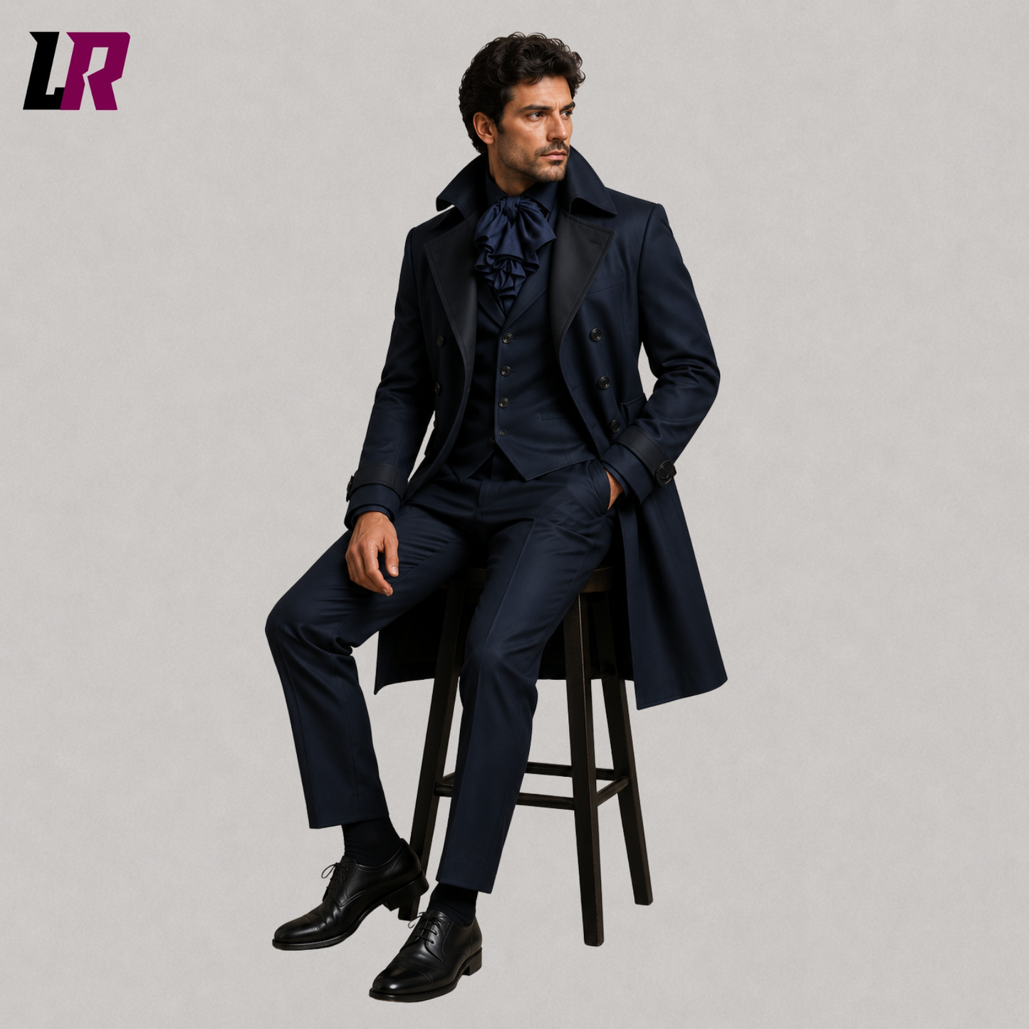 Man sitting on a stool wearing a navy Victorian Gothic tailcoat for weddings and formal occasions
