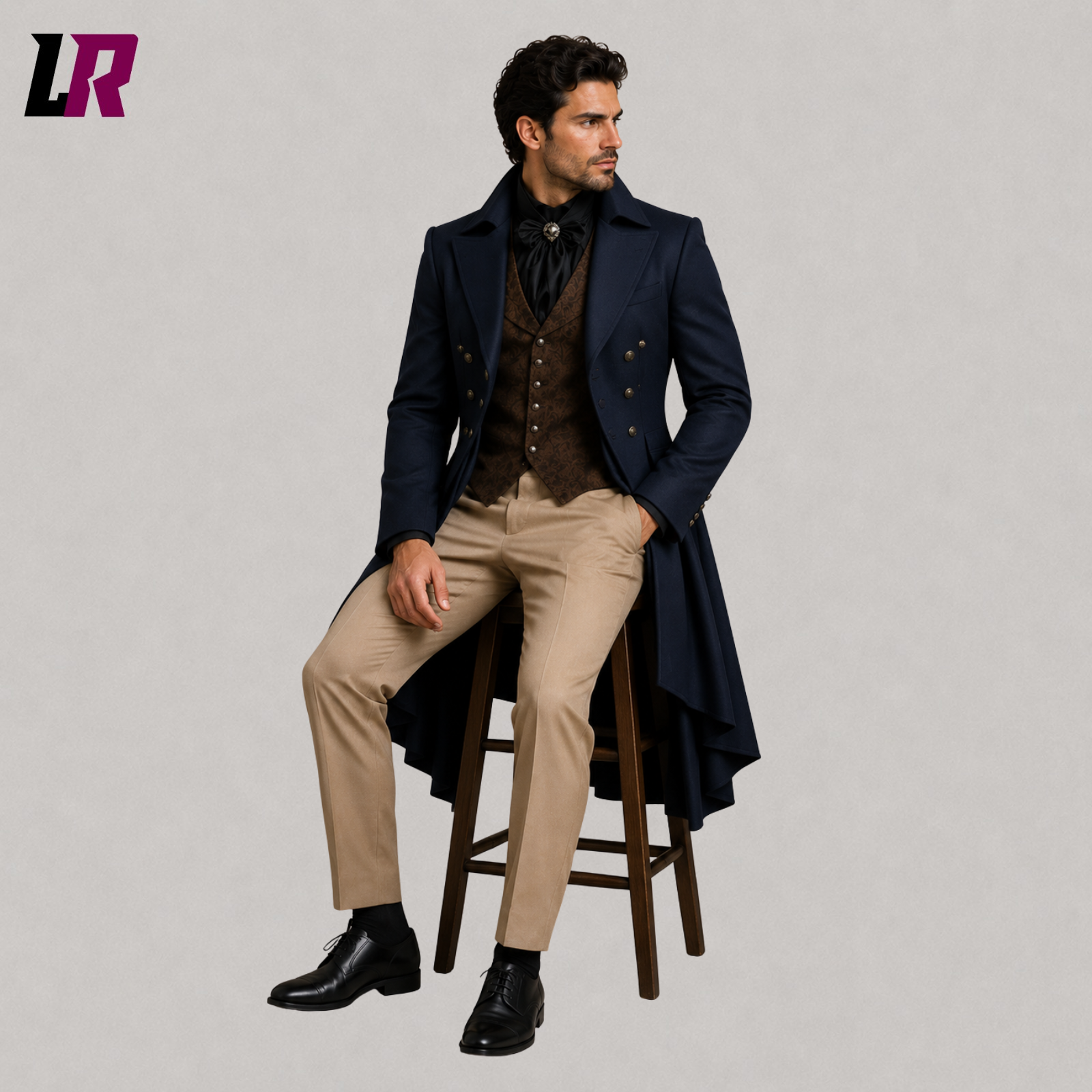 Man sitting on a stool wearing a navy Victorian Gothic 3-piece tailcoat suit for weddings and formal occasions