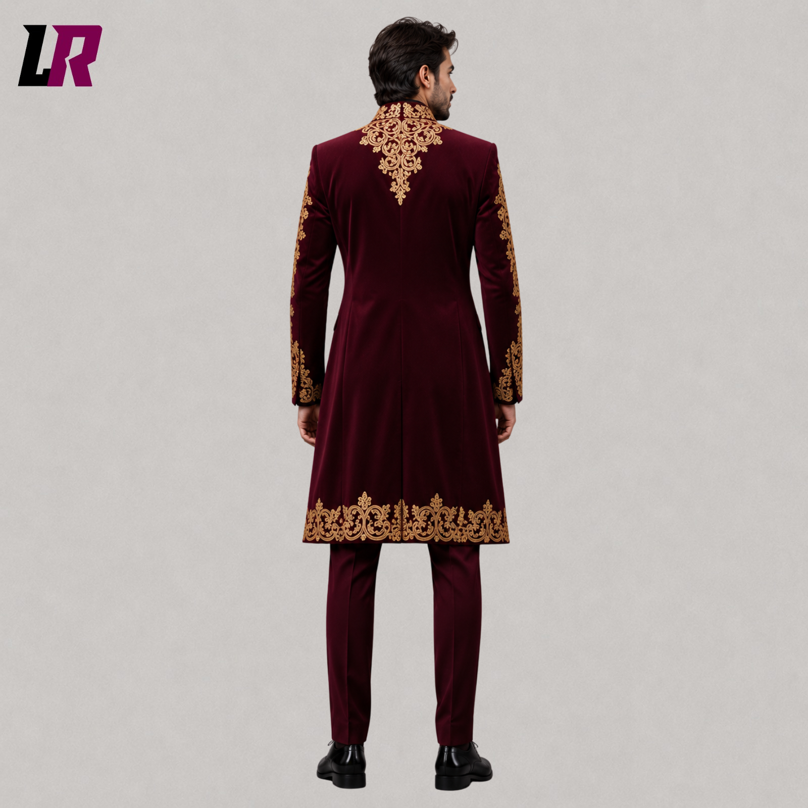 Back view of men's burgundy velvet Victorian tailcoat suit showing the elegant long embroidered coat silhouette