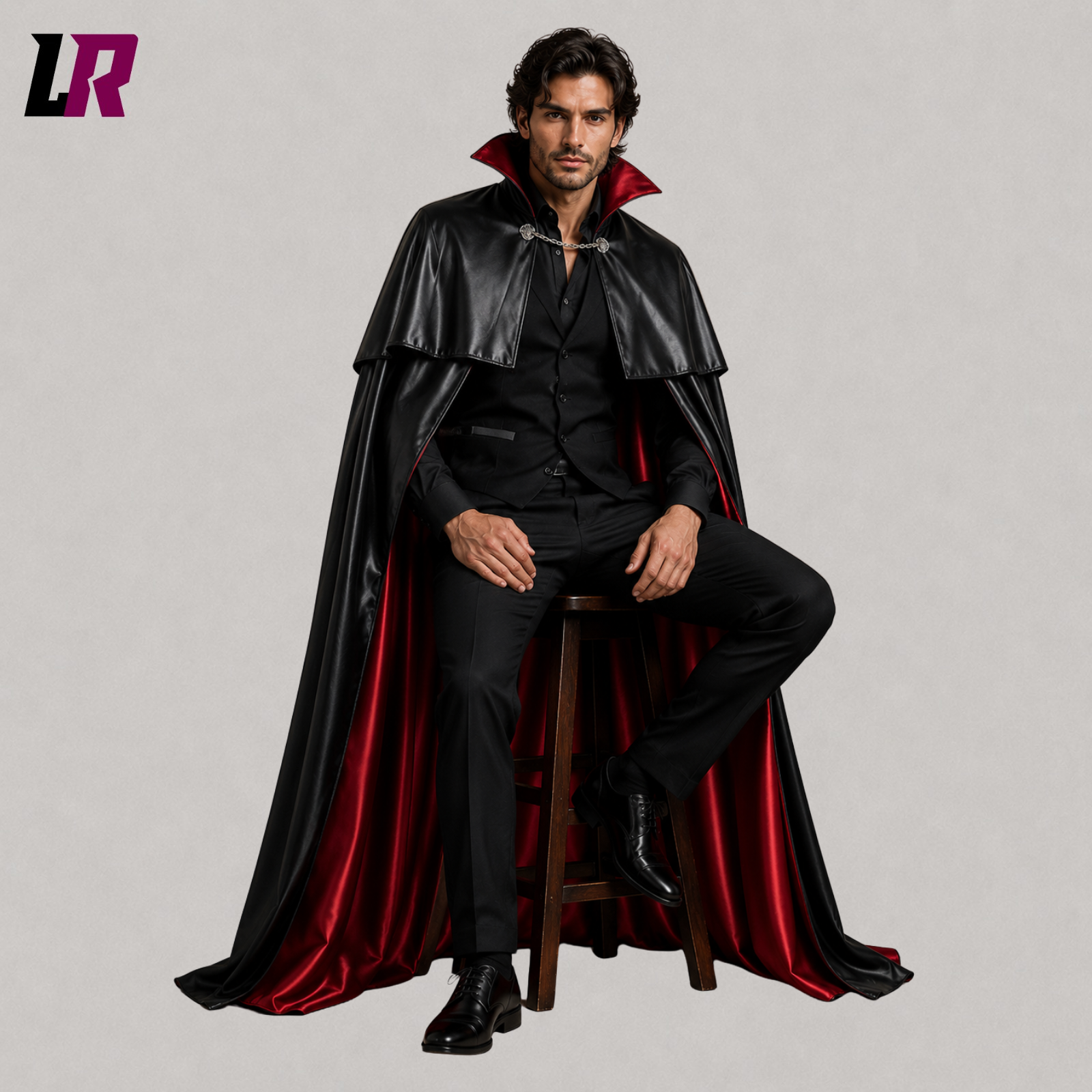 Man sitting on a stool wearing a full-length Victorian Gothic vampire cape for cosplay and Halloween events