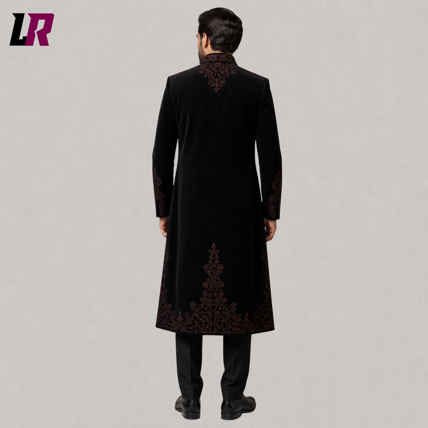 Back view of men's black velvet Victorian embroidered tailcoat suit showing the elegant long coat silhouette
