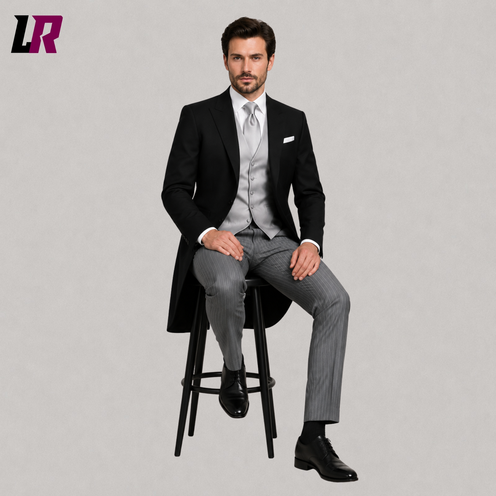 Man sitting on a stool wearing a black traditional morning suit with grey striped trousers for weddings and formal ceremonies
