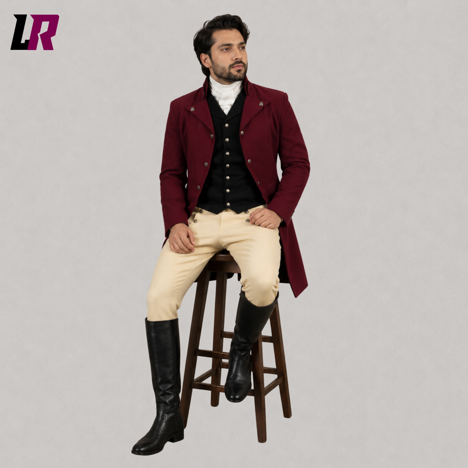 Man sitting on a stool wearing a handmade Regency Georgian military tailcoat suit with waistcoat and breeches