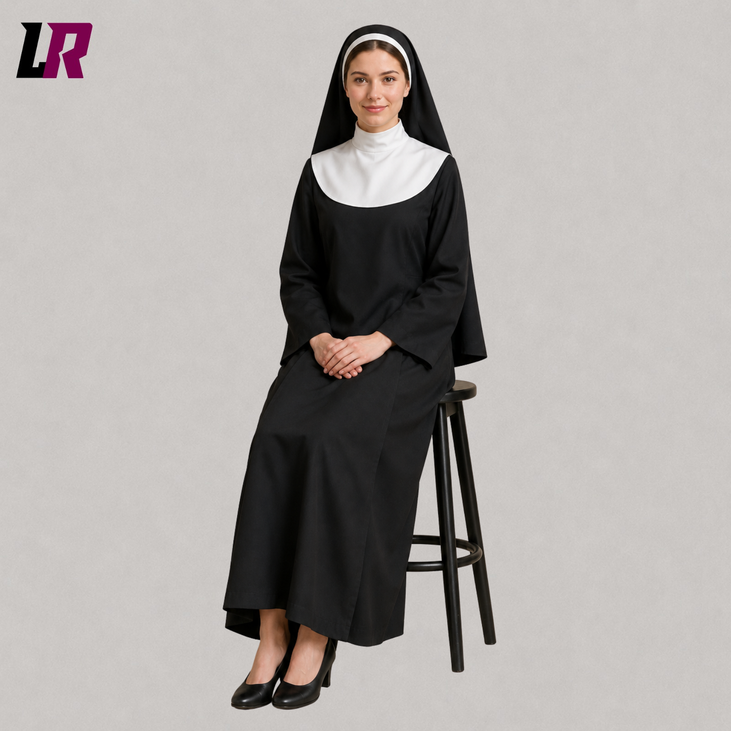 Woman sitting on a stool wearing a black nun-inspired costume with matching headpiece for cosplay and theatrical performances