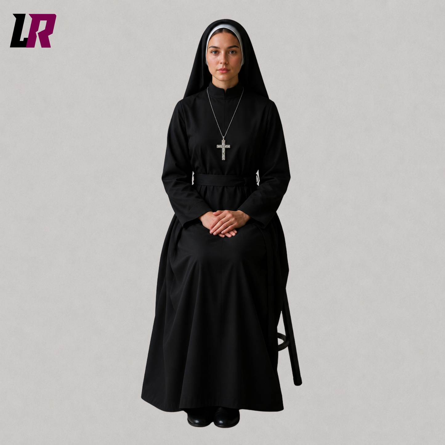 Woman sitting on a stool wearing a black nun habit dress with a matching veil for cosplay and theatrical performances