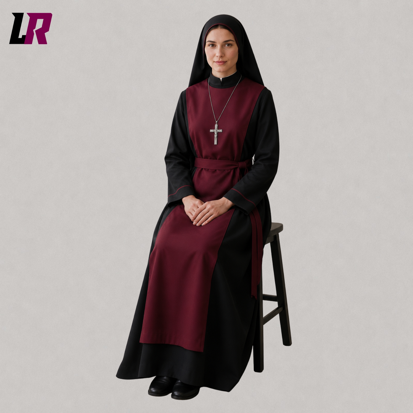 Woman sitting on a stool wearing a burgundy and black full-length religious-inspired habit dress