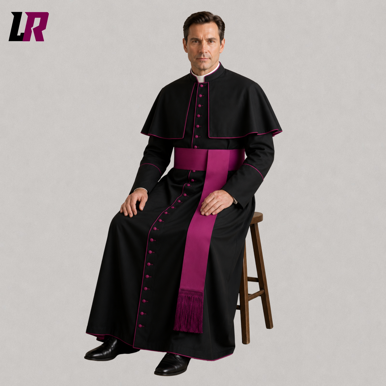 Priest wearing a black cassock with magenta piping seated on a stool in a formal portrait