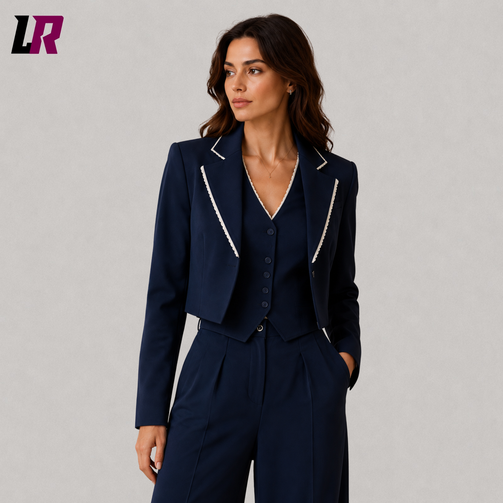 Close-up of women's navy blue business suit featuring cropped blazer and premium tailoring