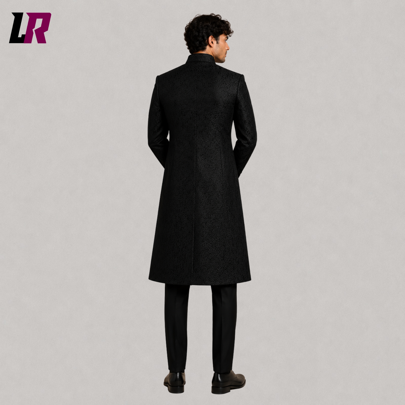 Back view of men's black brocade sherwani coat showcasing the elegant long prince coat design